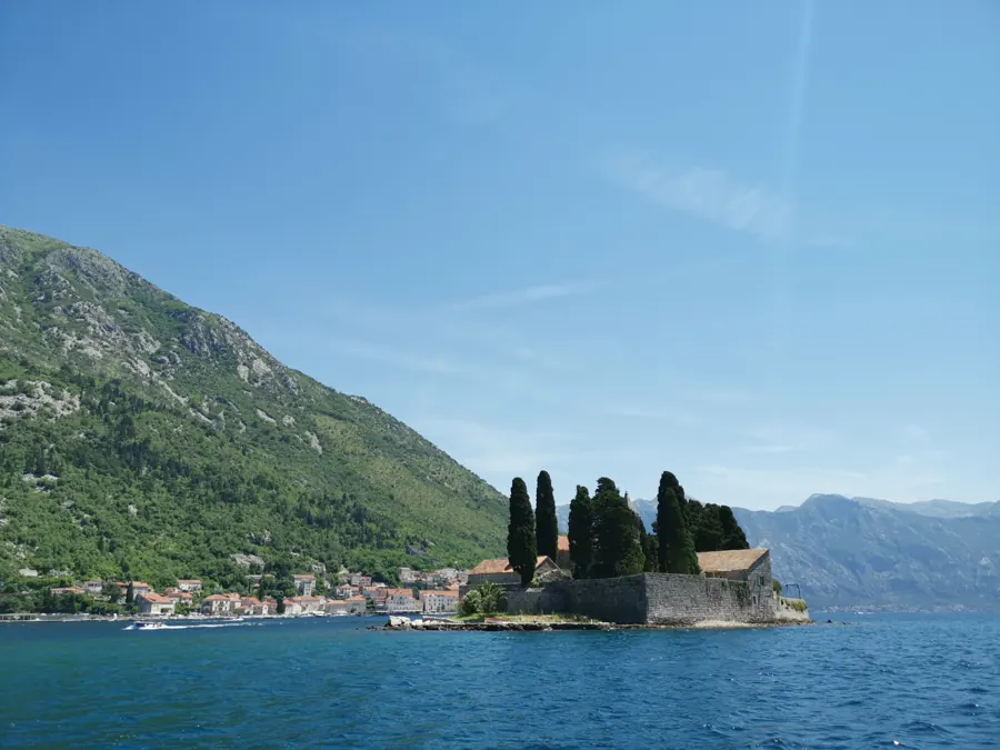 The island of St George with its cypresses, with Perast behind it